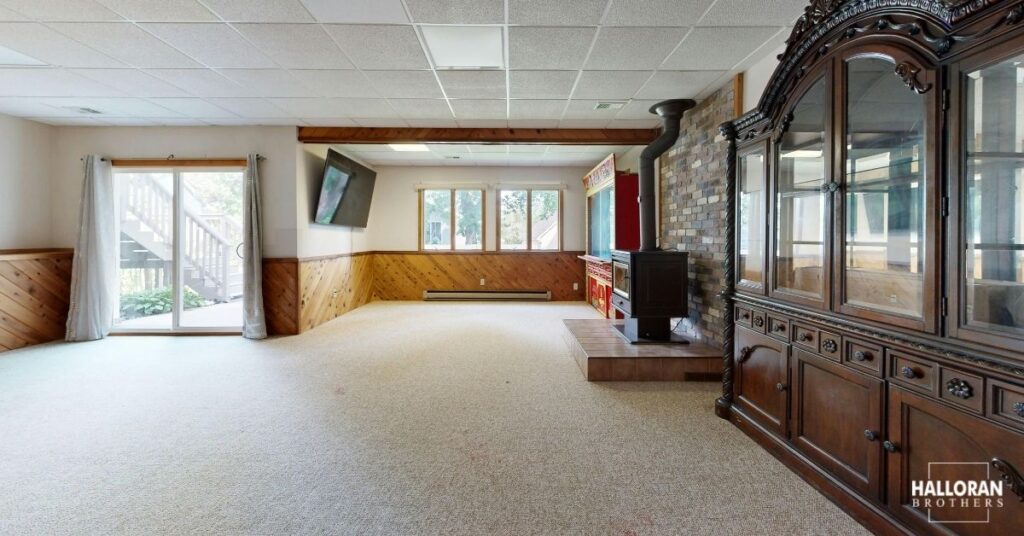 finished basement with carpet and wood paneling - Halloran Brothers basement remodel