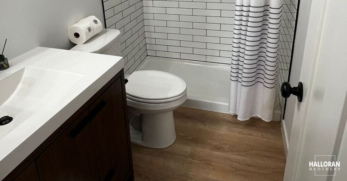 renovated bathroom with white shower tile - Halloran Brothers bathroom remodel