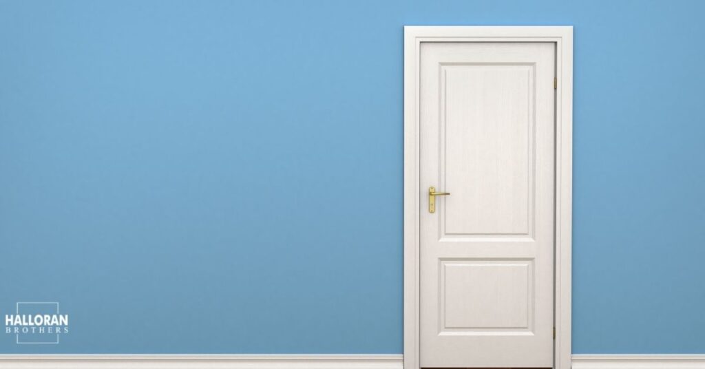 white door with light blue walls - Halloran Brothers Custom Interior Doors and Trim