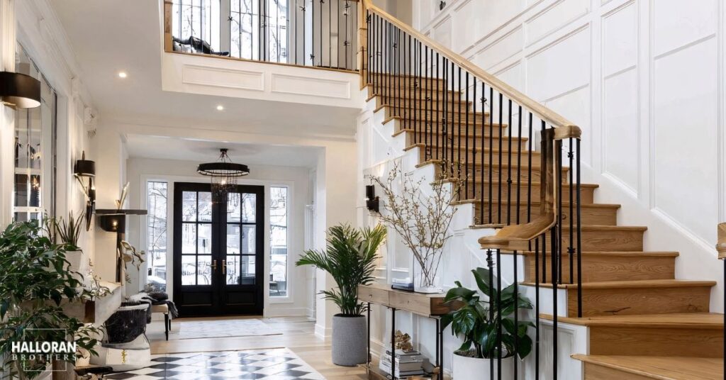 modern entry way with a custom staircase - Halloran Brothers millwork